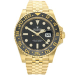 Rolex Datejust gold-tone watch with a black dial and black bezel, featuring gold-tone hour markers and a date window.