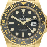 Rolex GMT-Master II wristwatch with a gold-tone case, black dial, and black bezel with gold numerals.