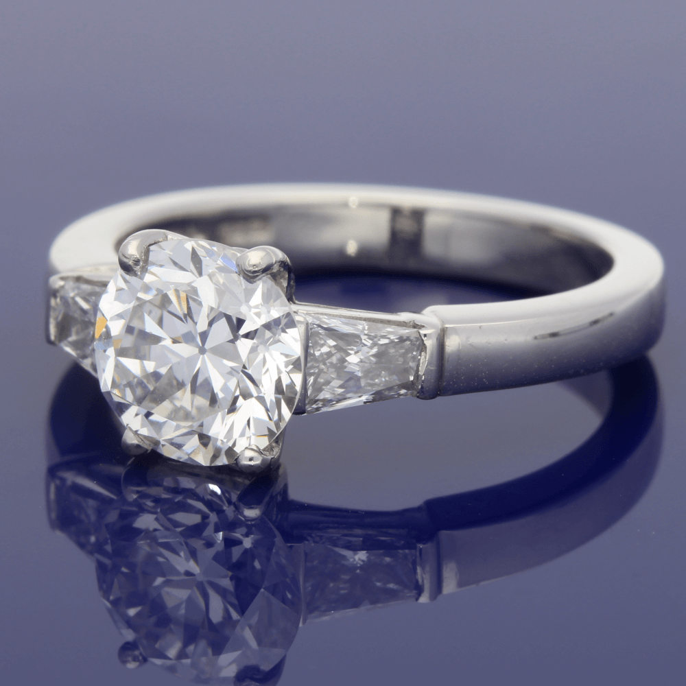 Platinum Solitaire Ring with Tapered Baguette Set Shoulders