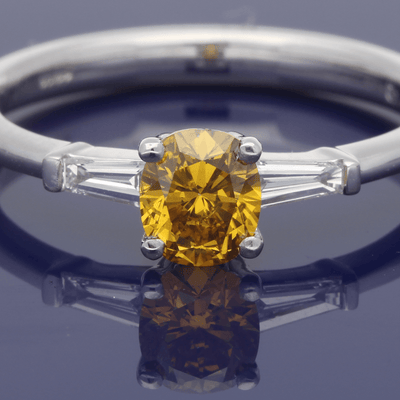 Platinum 0.54ct Certificated Fancy Natural Yellow Diamond Solitaire Ring with Tapered Baguette Set Shoulders