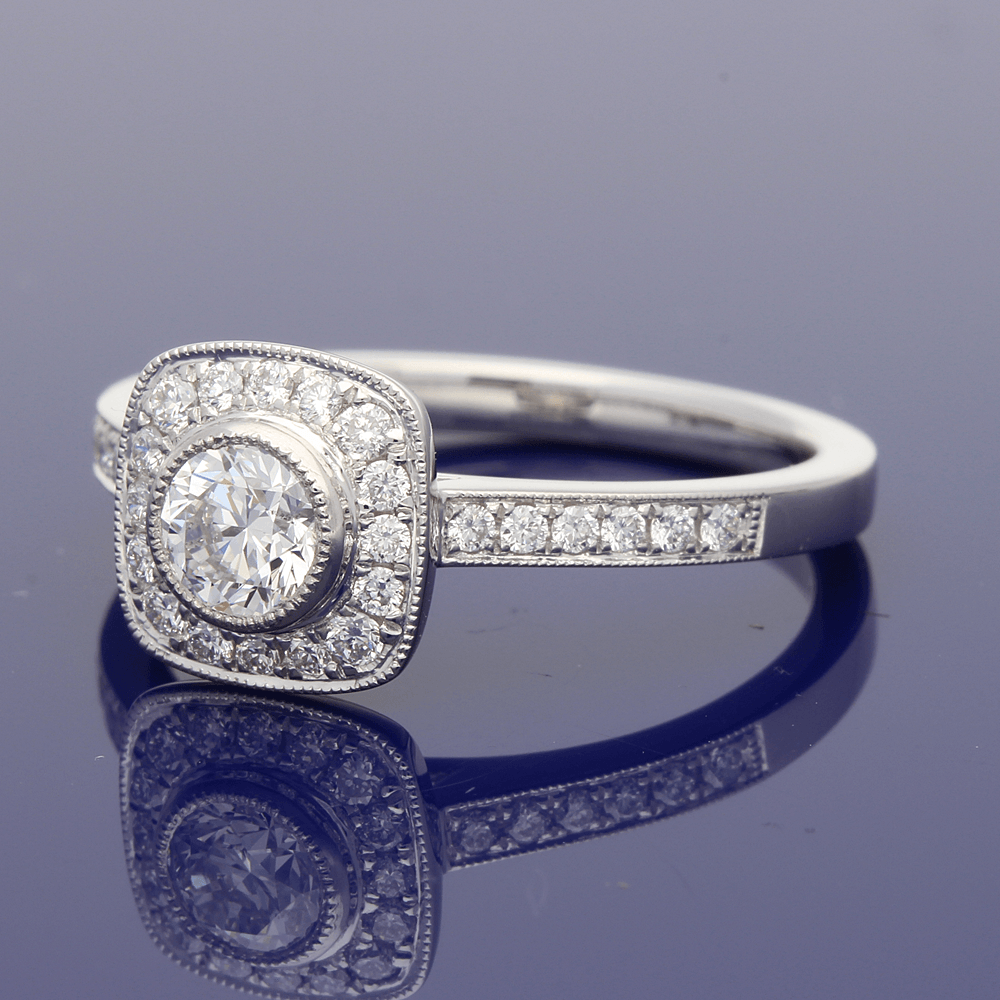 Platinum Diamond Halo Ring with Diamond Set Shoulders