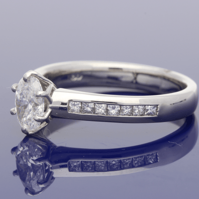 Platinum Certificated 0.70ct Oval Diamond Solitaire Engagement Ring with Princess Cut Diamond Shoulders
