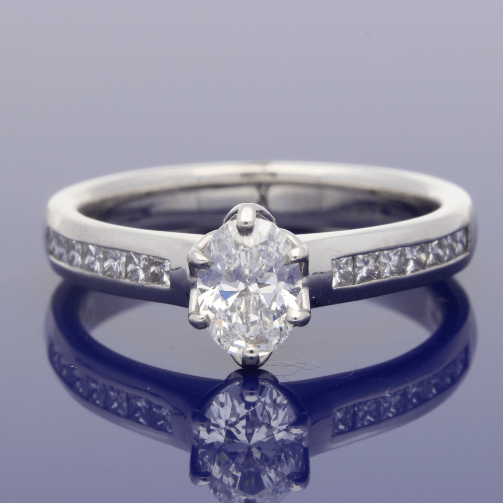 Platinum Certificated 0.70ct Oval Diamond Solitaire Engagement Ring with Princess Cut Diamond Shoulders