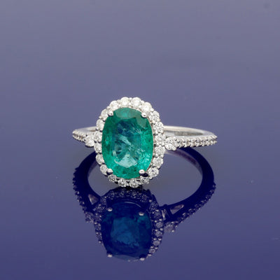 White Gold Oval Emerald and Diamond Halo Cluster Ring with Diamond Shoulders