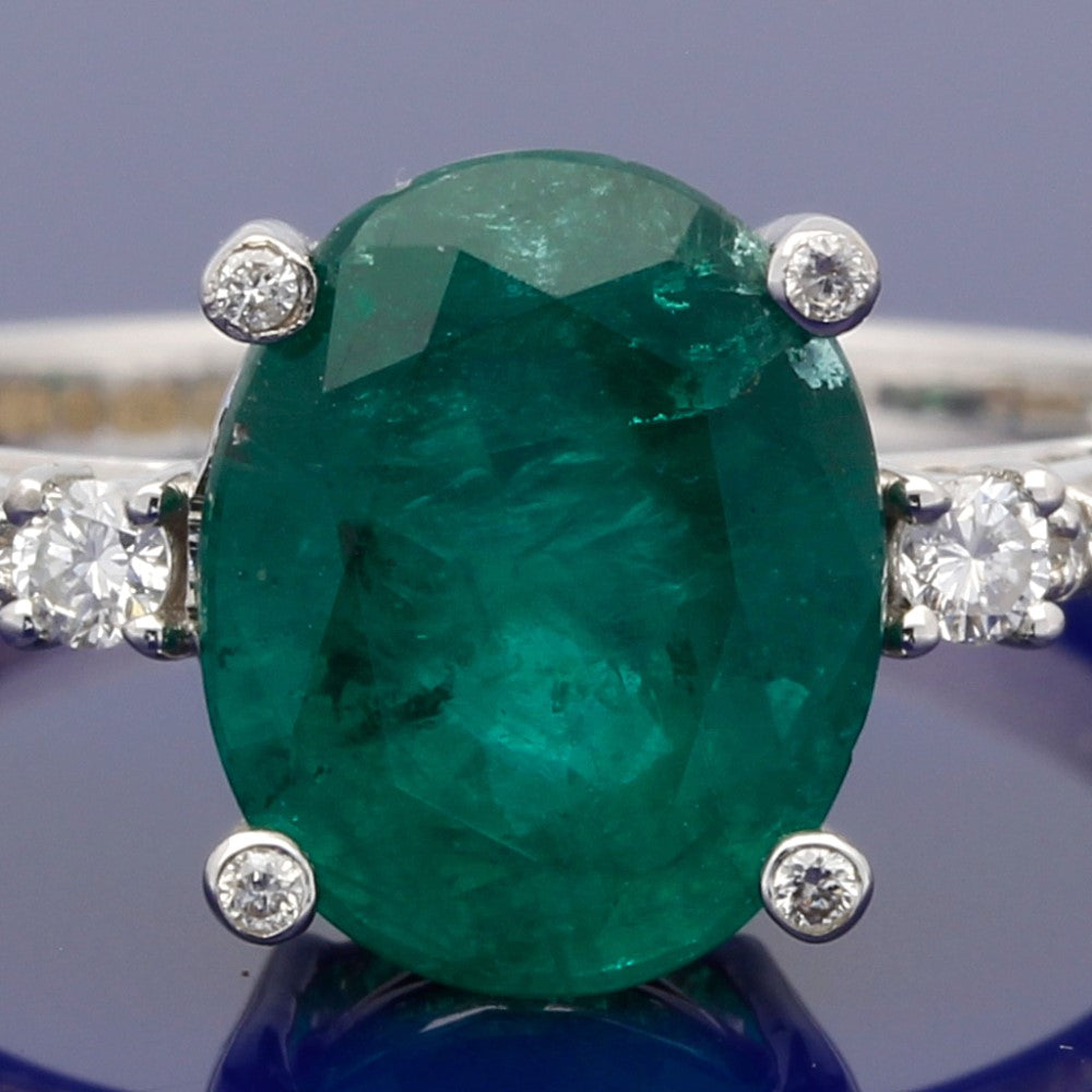18ct White Gold Large Oval Emerald Ring with Diamond Shoulders