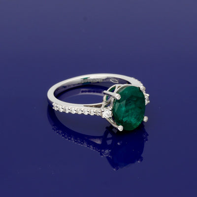18ct White Gold Large Oval Emerald Ring with Diamond Shoulders